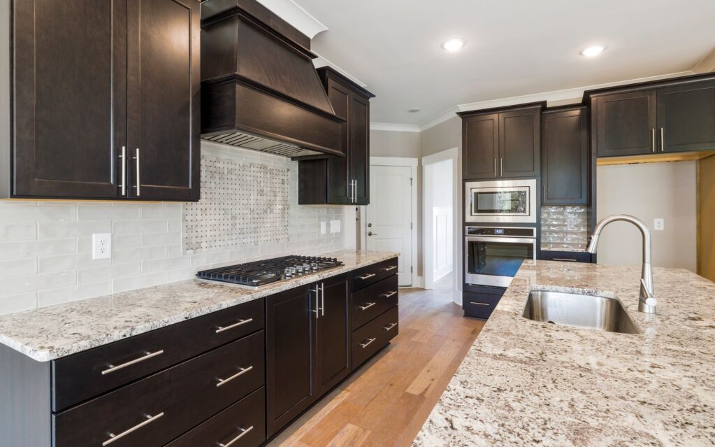 Kitchen with dark cabinets and a granite countertop - kitchen and bath, Parsippany