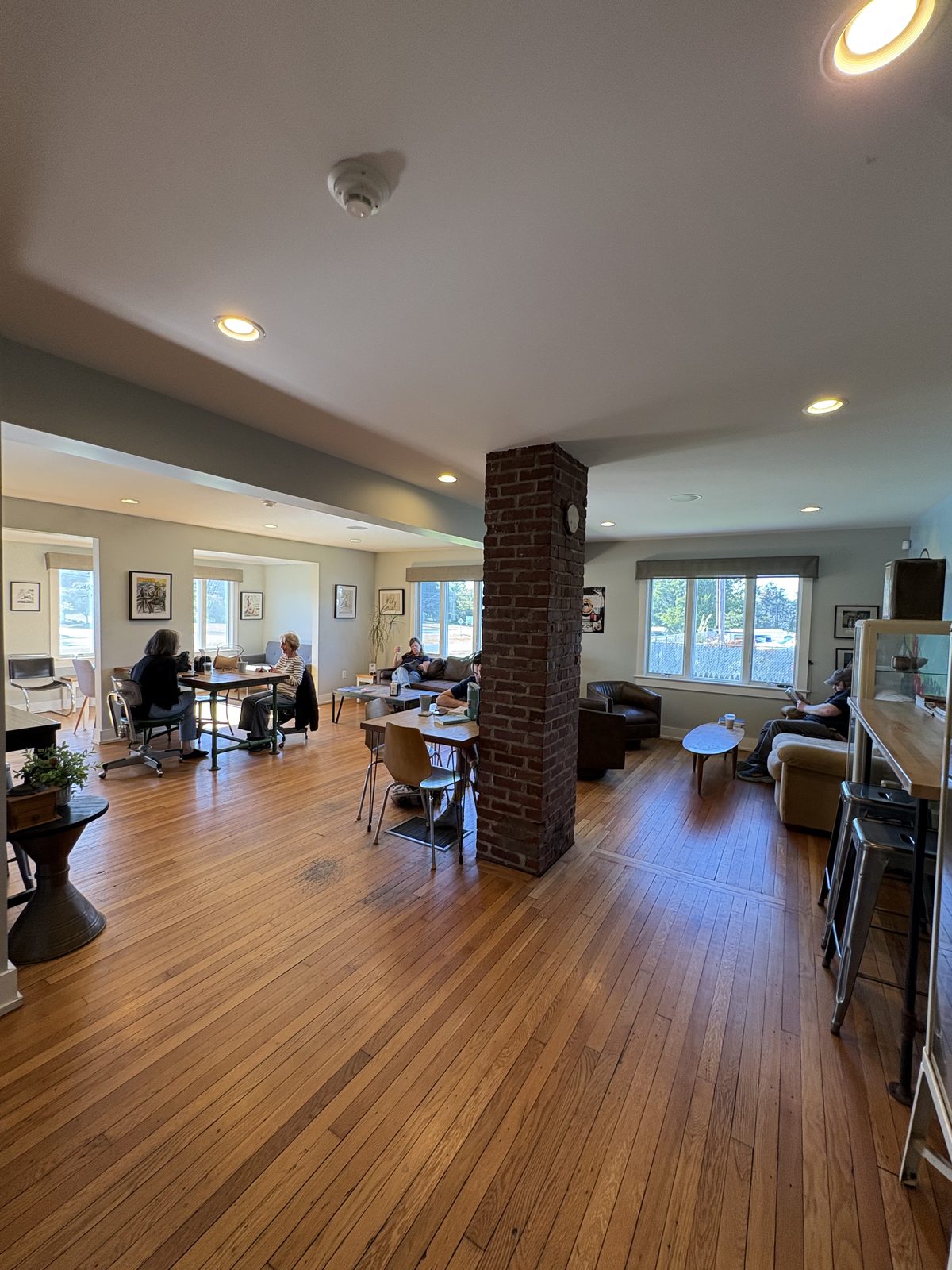 Black River Roasters, Whitehouse Station - the lounge with couches, tables and a brick pillar