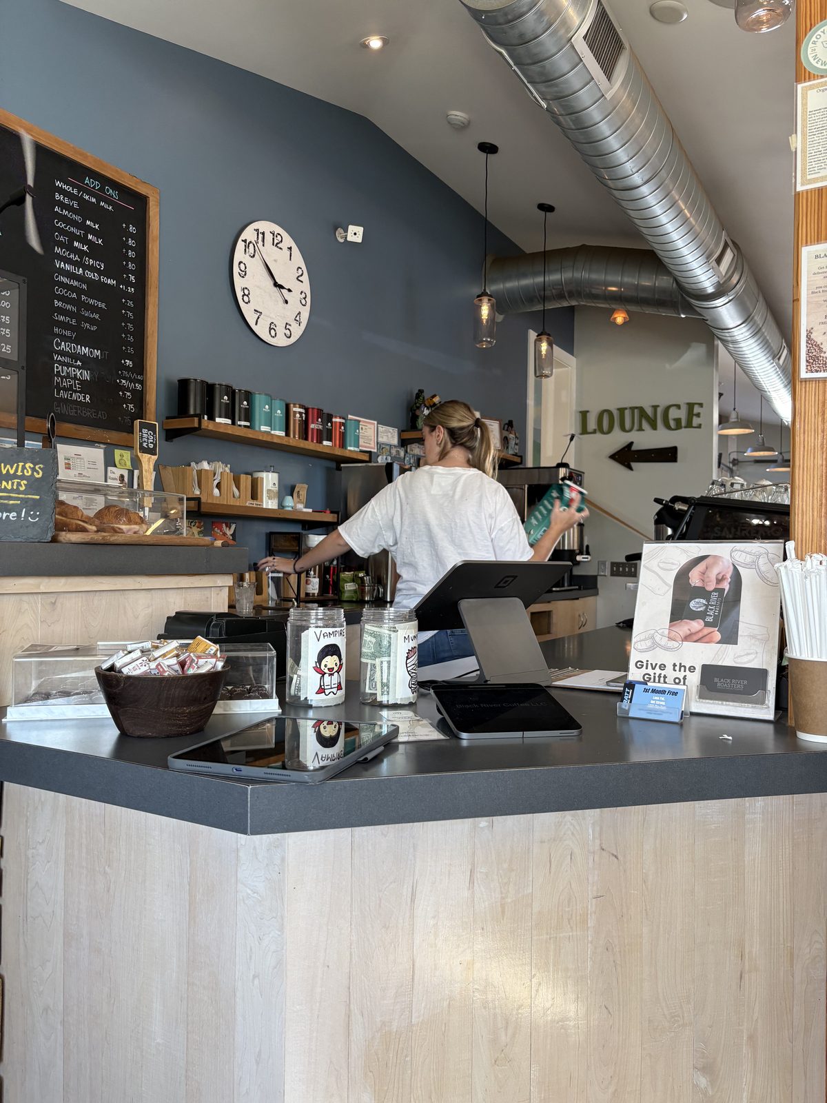 Black River Roasters, Whitehouse Station - the counter with a barista and menu chalkboard