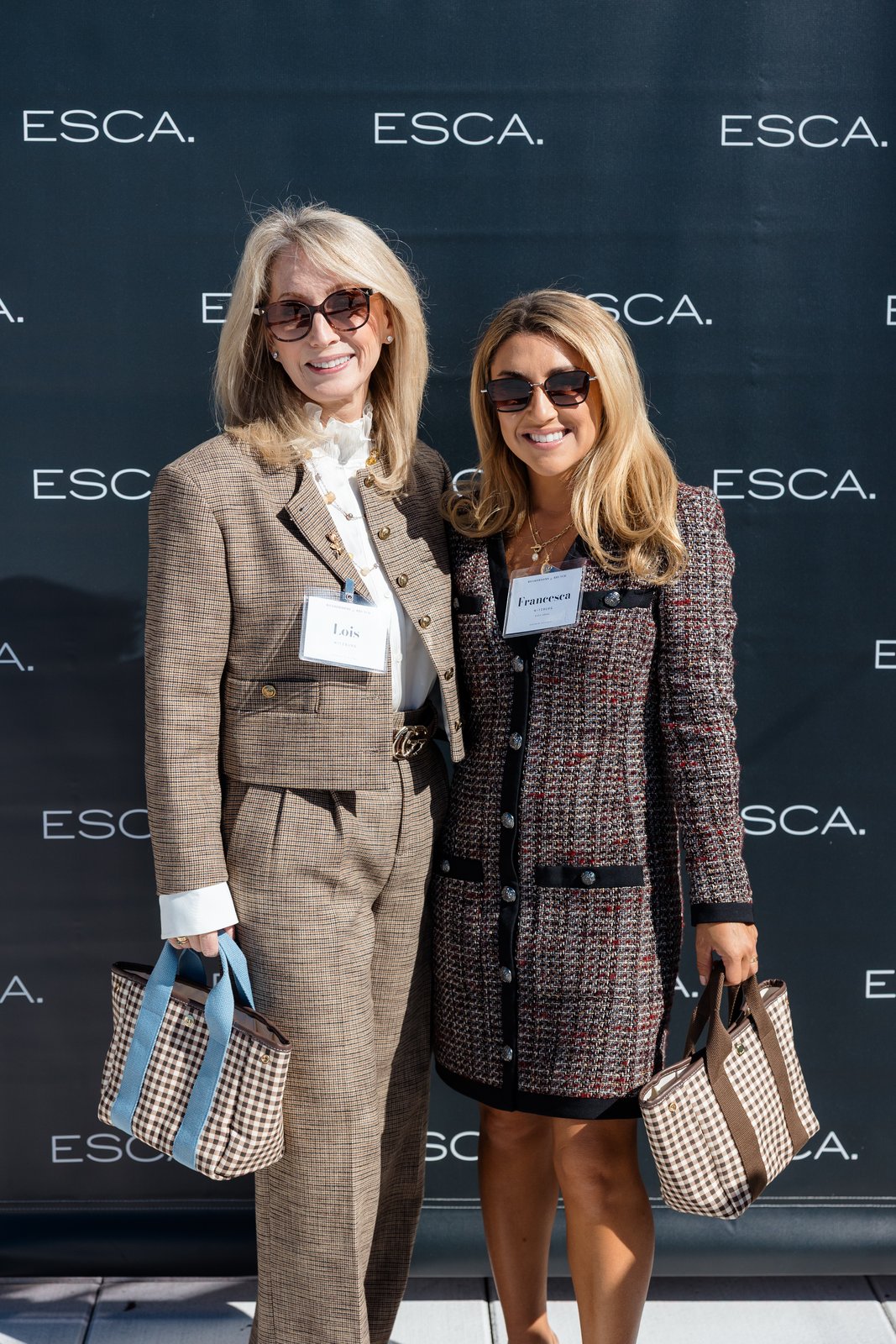 Boardrooms & Brunch, Pendry Natirar, Oct 9 2026 - two women posing in front of an ESCA-branded photo backdrop