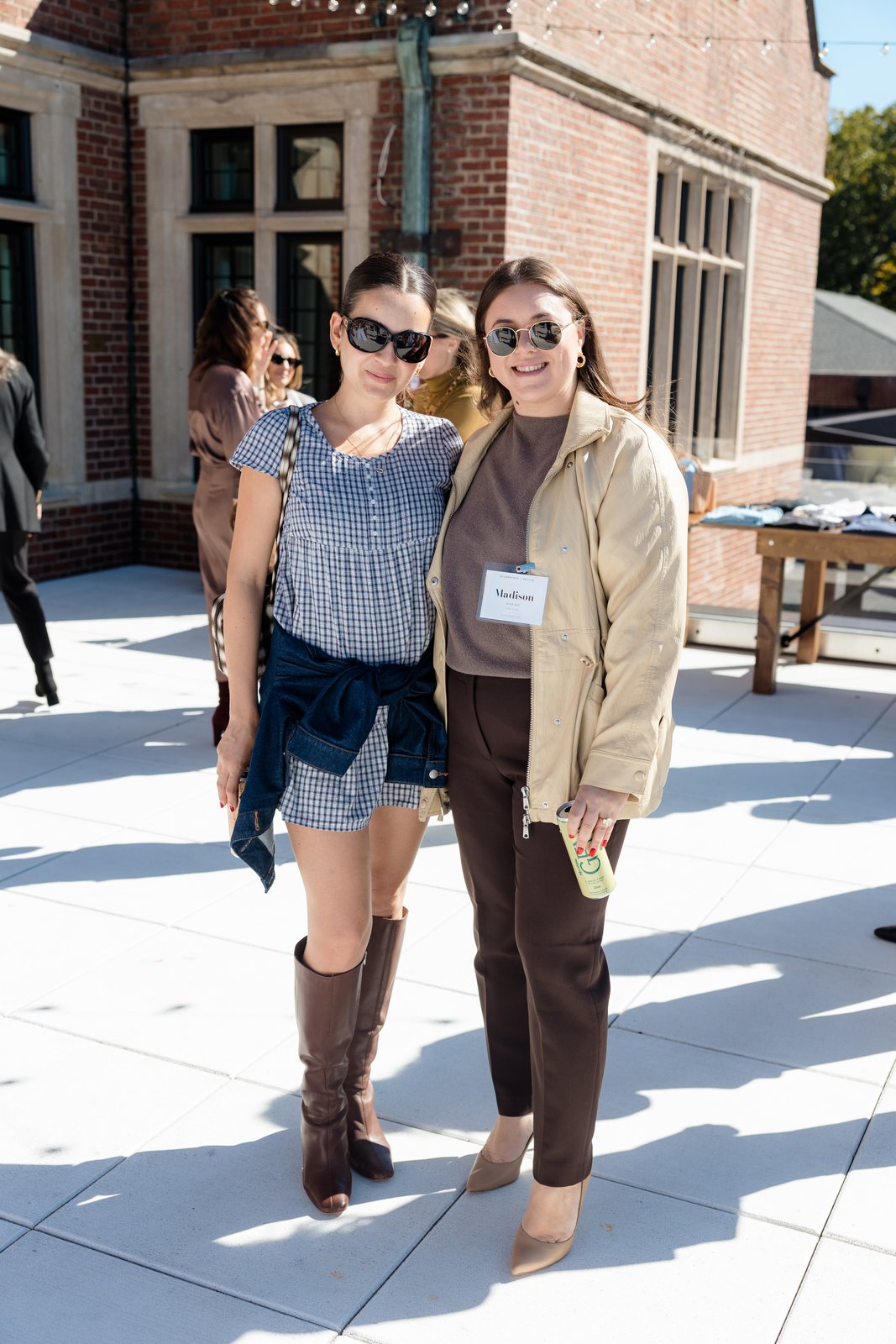 Boardrooms & Brunch, Pendry Natirar, Oct 9 2026 - two guests posing on a stone terrace beside a brick building