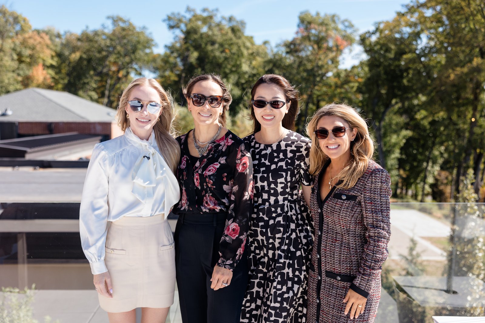 Boardrooms & Brunch, Pendry Natirar, Oct 9 2026 - four guests posing outdoors with autumn trees behind them