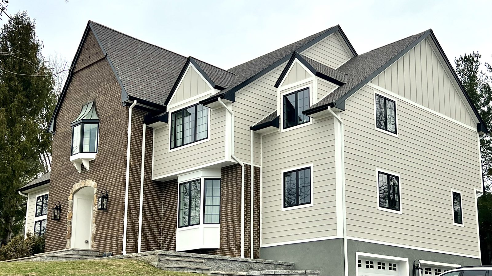Magnolia Home Remodeling Group, Mendham NJ: side view of the home with James Hardie lap and board and batten siding and Andersen windows