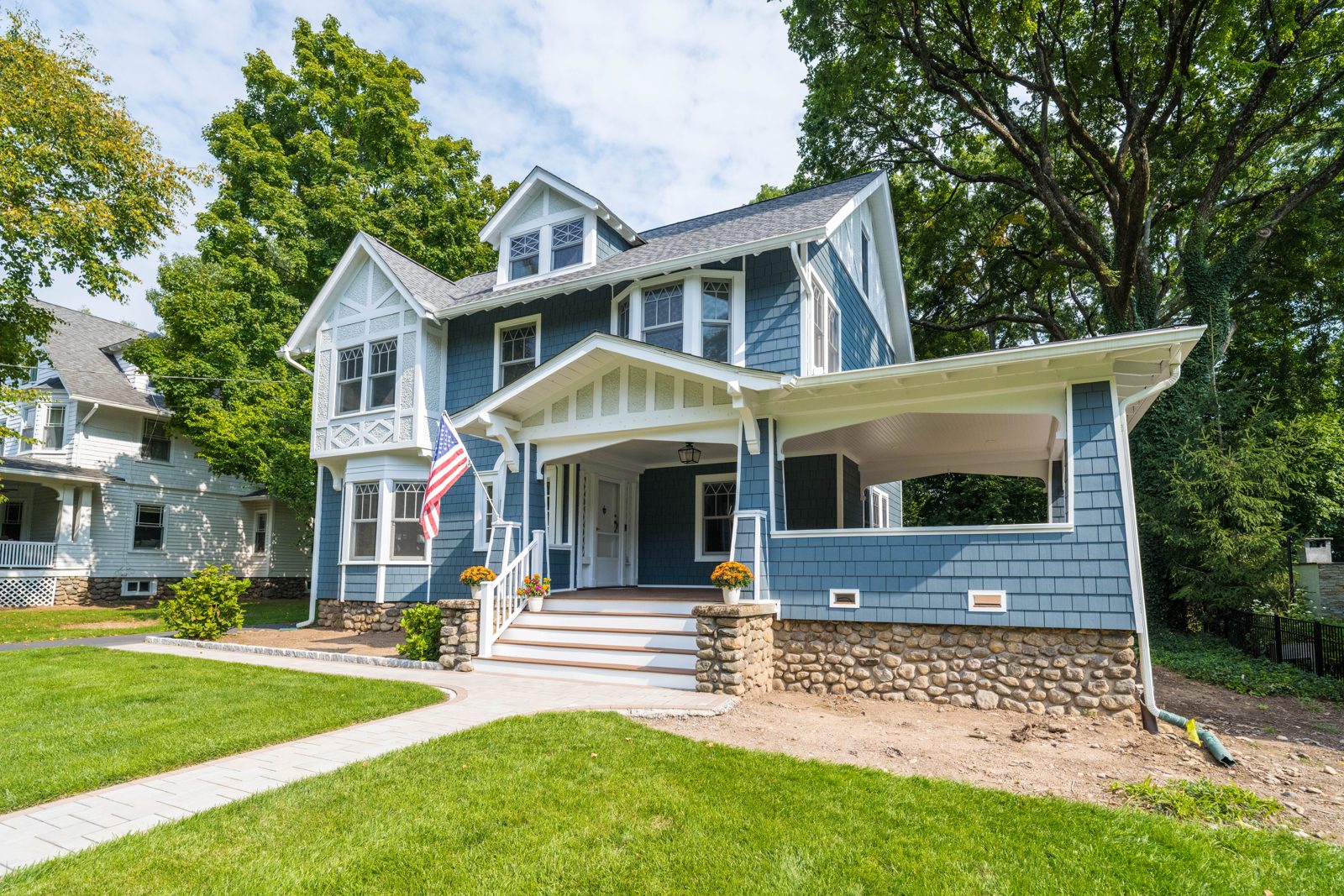 Magnolia Home Remodeling Group, Ridgewood NJ: blue James Hardie shingle siding on a house with a covered front porch