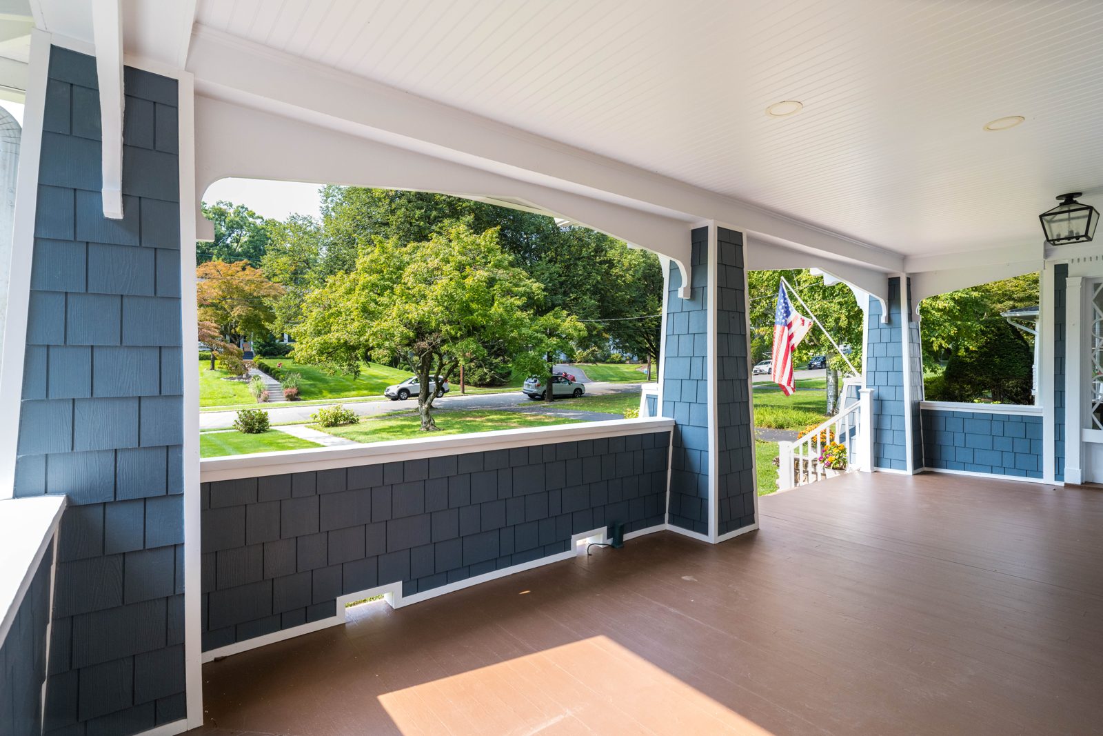 Magnolia Home Remodeling Group, Ridgewood NJ: front porch with TimberTech decking and shingle-sided columns